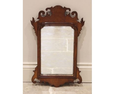 A George III style mahogany fret work mirror, the rectangular mirrored plate within a gilt moulded border, 58cm H x 35cm W 