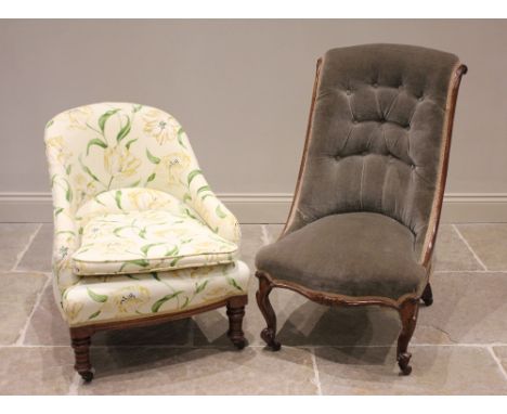 A Victorian walnut and upholstered tub chair, re-covered in lily pattern fabric, raised upon ring turned and incised front le