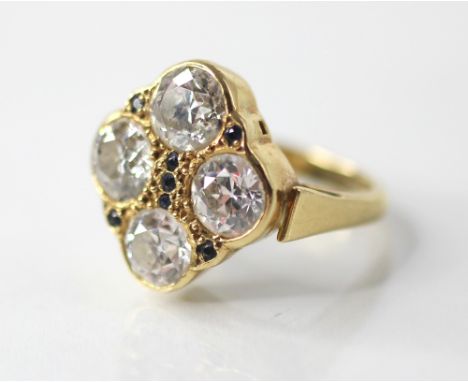 A diamond four-stone ring, comprising four round old cut diamonds, measuring approximately: 6.58mm x 6.54mm x 3.90mm, 6.70mm 