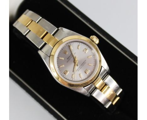 A lady's Rolex Oyster Perpetual Superlative Chronometer, the circular brushed steel coloured dial with gold toned Arabic nume