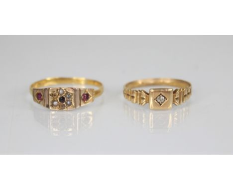 A Victorian diamond set 15ct gold ring, the central old cut diamond set to a square head, continuing to shaped shoulders and 