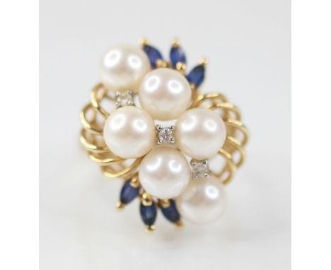 A pearl, sapphire and diamond 14ct gold cocktail ring, designed as six round cultured pearls, interspersed by small brilliant