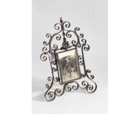 20th century wrought iron easel photograph frame, of arched scrolling form, 26cm tall