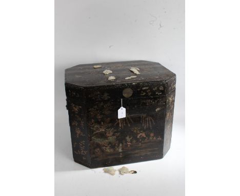 Edwardian ebonised and mother of pearl decorated box and cover, the hinged lid decorated with two raised mother of pearl geis