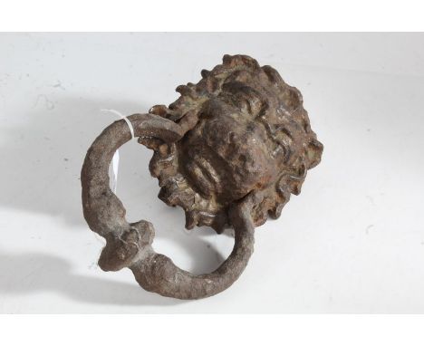 A George III style door knocker modelled as a lion with a ring to the mouth, 23cm high 15cm wide&nbsp;