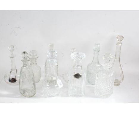 Ten Edwardian and later glass decanters, two with plated decanter labels for Vodka and Apricot Brandy (10)