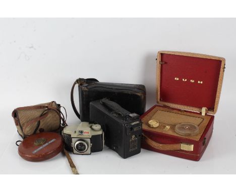 Cine Kodak model 2 with case together with a Kodak Brownie Cresta 3 camera with case, Bush portable radio and a tape measure 