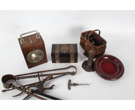 Collection of works of art and objects to include a hand held lamp, miniature wicker basket, a steel lever corkscrew '57 Corn