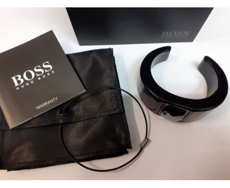 Hugo boss- A modern black plastic bangle with central rectangular and faceted silver coloured decoration with warranty, brand