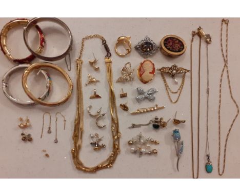 A quantity of costume jewellery to include an engraved silver bangle stamped with the makers mark JS (possibly Joseph Smith &