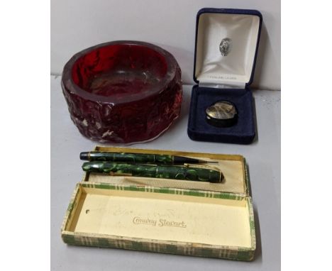 A mixed lot to include a Whitefriars ruby glass bowl, silver pill box, and boxed Conway Stewart pen and pencil Location: 