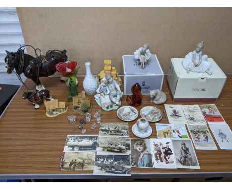 A mixed lot of china and glassware to include Nao, Lladro porcelain figures, Swarovski crystal animals, Nobile fused glass fl