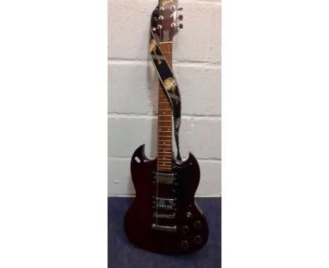 A Gibson replica electric 6-string guitar in cherry red with Gibson shoulder strap. Location:RWBCondition:Only one string int