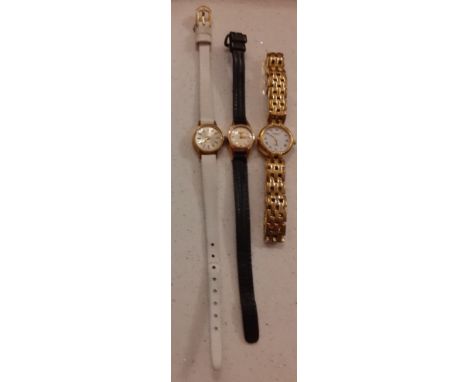 Three ladies cocktail watches to include a gold tone Raymond Weil watch, a Tissot watch on a cream leather strap and a yellow