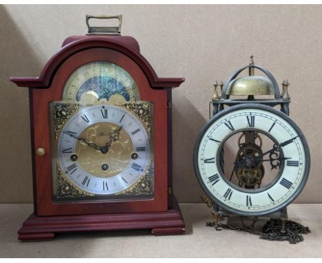 Two reproduction clocks to include a Franz Hermle mantel clock and a lantern clock Location: 