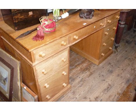 Light oak kneehole nine-drawer pedestal desk