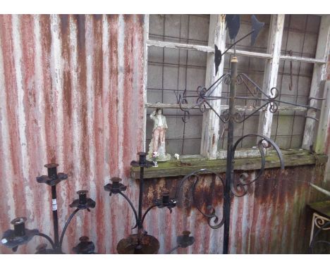 Pair of wrought iron garden 5-branch candle strands and a similar with weather vane and cockerel to top