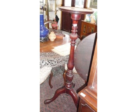 Tall 19th c. mahogany torchere with turned column on tripod padfoot legs