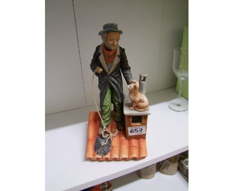 Capodimonte figure depicting a Chimney Sweep and cat on a roof, height 28cm. 