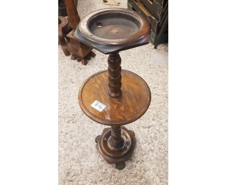 Late 19th century oak smokers stand, bobbin turned details, sitting on brass lions paw feet, 64cm in height. 
