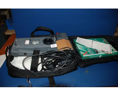 An overhead Projector with instructions in carrying case