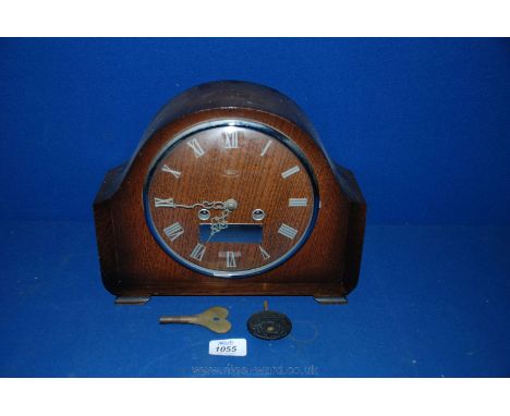 A wooden cased Smiths of Enfield chiming Mantle Clock, with key and pendulum