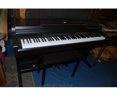 A Yamaha Clavinova in dark Rosewood finished case with seven octave keyboard, stereo sampling recorder, and featuring Grand a
