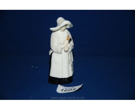 A Royal Worcester Nun Candle Snuffer.