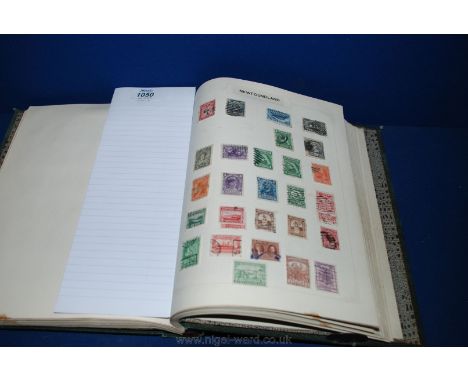 A green Crown Album 'The Stamp Album' with extensive British Empire and Commonwealth stamps - Queen Victoria to George VII bu