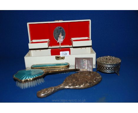 A white and gilt coloured Musical Jewellery Box along with a white metal trinket box, dressing table brushes and a hand mirro