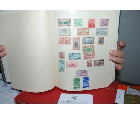 A green Simplex Stamp album with British Empire and Commonwealth stamps, with strength in New Zealand and Pakistan