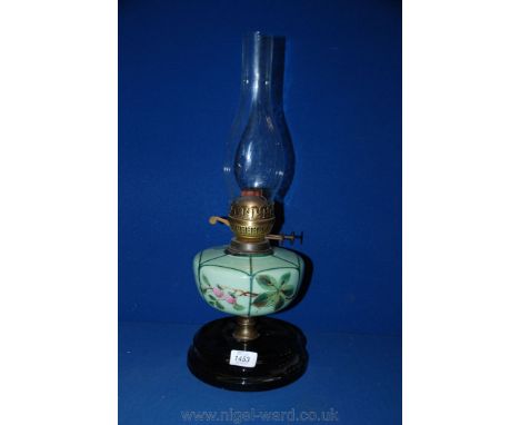 An Oil Lamp with painted glass reservoir and chimney