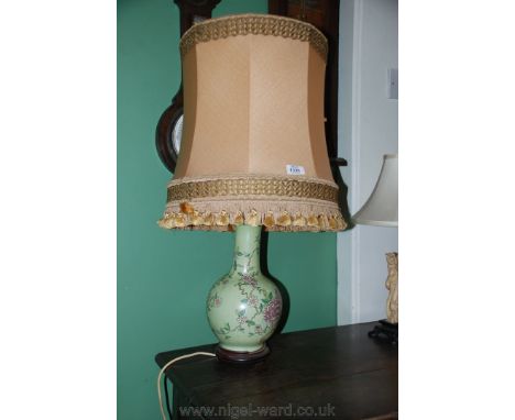 An oriental decorated Table Lamp complete with  large tassel shade