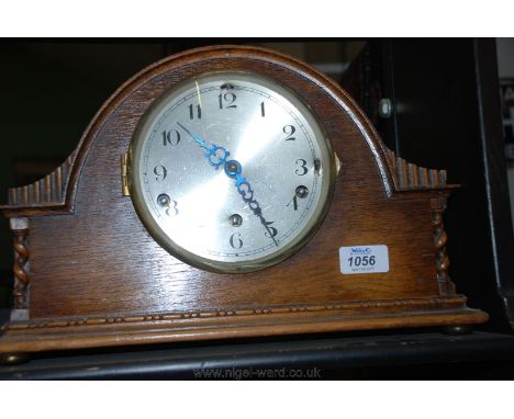 A large wooden cased Bravingtons Ltd. chiming Mantle Clock