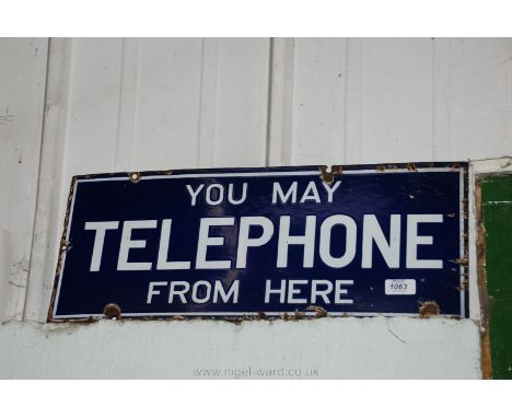 An enamel 'You May Telephone From Here' sign.