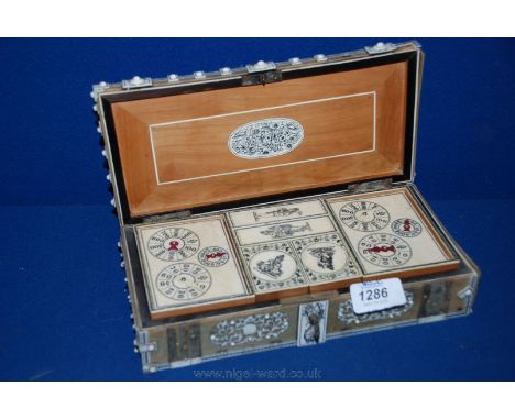 An Indian Games Box decorated with ivory/bone and containing an ivory Cribbage Set, outside of box a/f, but pieces retained.