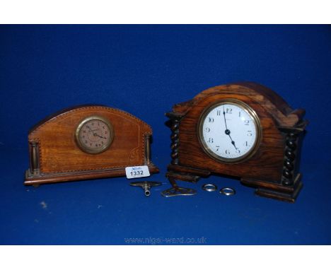 A French eight day Mantle Clock with an enamel dial and barley twist columns plus an inlaid mantle Clock with brass columns.