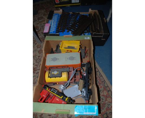 A large quantity of Playmobil plastic train track, together with a Transformer engine and wagons.