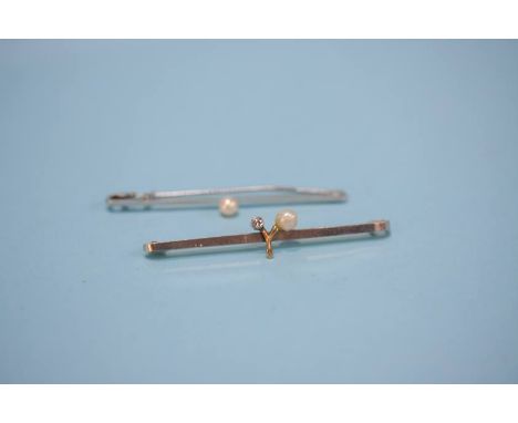 A 9ct white gold bar brooch, mounted with a pearl and one other