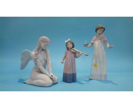 A Lladro figure of an angel and two other Lladro figures (3)