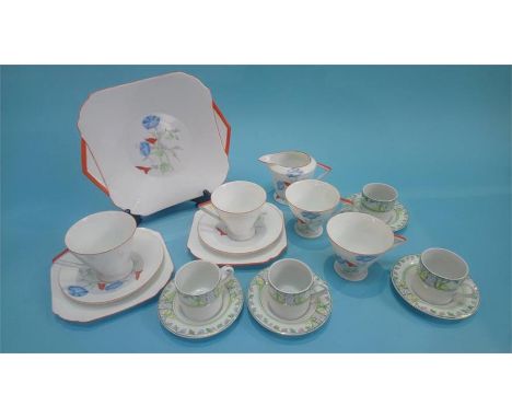 A 1930's Art Deco Shelley tea set, pattern number 2195, decorated with flowers and having triangular handles, and four coffee