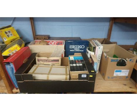 Shelf of watch spares and books