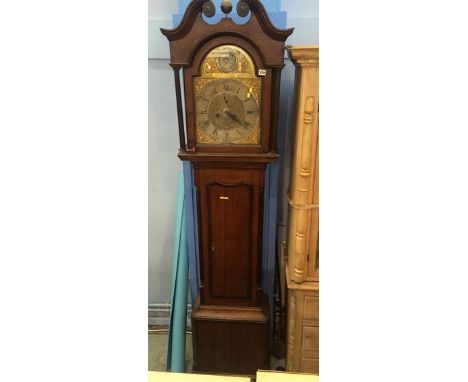 An oak long case clock, with eight day movement by Blacklock of Longtown, with silvered dial and two subsidiary dials