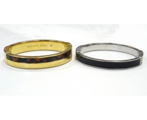 MICHAEL KORS BANGLE in gold tone with tortoiseshell effect band; and a DKNY bangle (2)