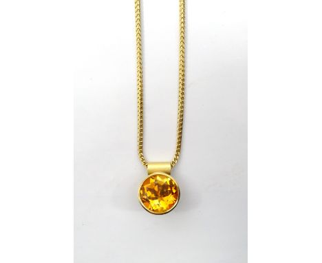 MODERN DESIGNER CITRINE PENDANTthe round brilliant cut citrine approximately 5cts, in eighteen carat gold and on eighteen car