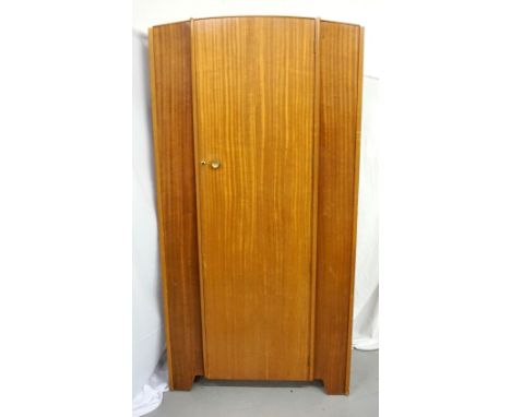 1960s TEAK WARDROBElabelled 'Chancellor' and with 'BSA' mark, with single door, upper shelf and rail interior, raised on shap