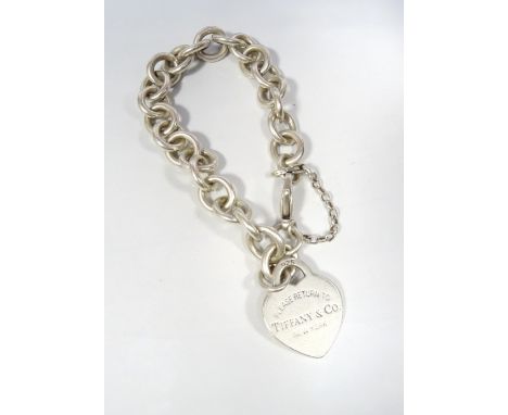 TIFFANY & CO. SILVER HEART TAG CHARM BRACELETwith iconic Return to Tiffany tag, with additional safety chain