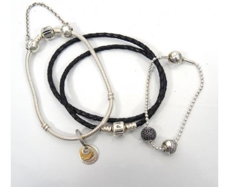 THREE PANDORA BRACELETScomprising a moments silver charm bracelet with one charm and a safety chain; an essence silver ball c