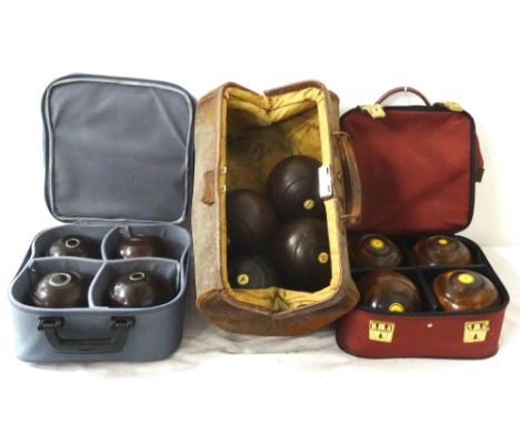 SET OF FOUR VINTAGE BOWLING BALLSby 'R.G.Lawrie Glasgow', ivory buttons, with leather carrying bag, a later Henselite set, tw