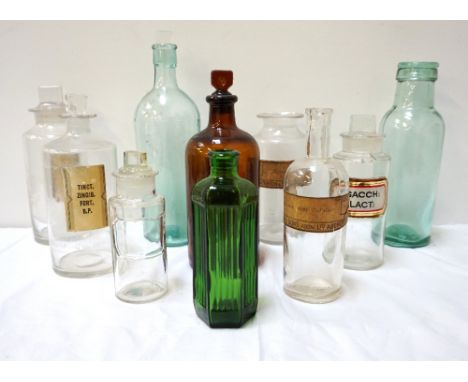 SELECTION OF TEN VINTAGE CHEMIST BOTTLESone with a label with gilded borders, some with paper labels and various size stopper